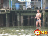 Asian Man Fishing In Undies