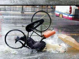 Rain + Bike + Umbrella + Pothole = Fail